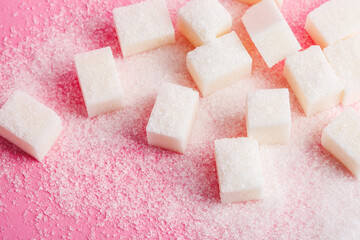 Sugar cubes on pastel pink background, macro food photography