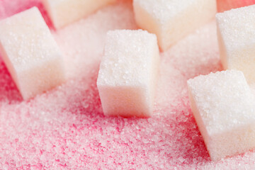 Sugar cubes on pastel pink background, macro food photography