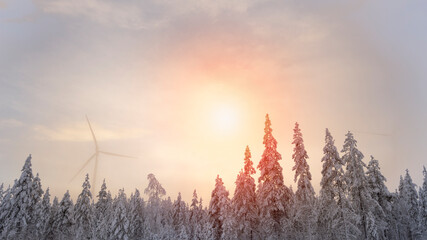 Wind turbine in forest. Winter landscape-