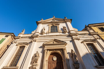 Fototapeta na wymiar Vicenza. Main facade of the Church of Santa Maria dei Servi (Chiesa di Santa Maria in Foro detta dei Servi) in Renaissance style, 1407-1425, Piazza dei Signori, Veneto, Italy, Europe.