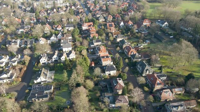 Aerial of large houses in a beautiful and wealthy town