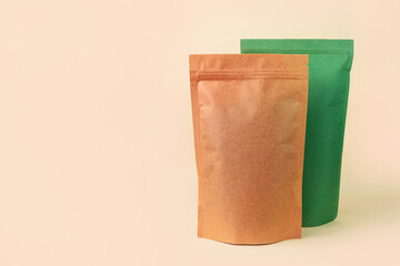 Pouch bags mockup assortment neutral beige background. Merchandise packaging Blank brown green paper pack coffee beans product template copy space Tea food snack delivery Shop store sale demonstration