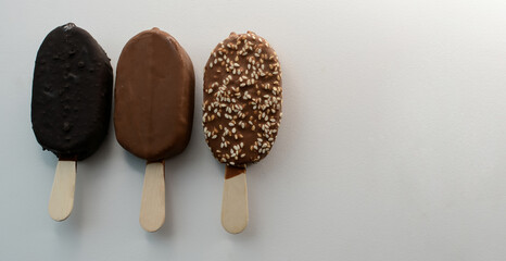 Delicious ice cream in chocolate glaze