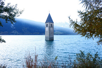 Church under water, drowned village, the lake In South Tyrol (Italy)
