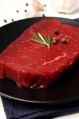 Concept of cooking with raw beef steak, close up