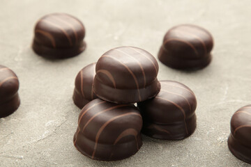 Chocolate sweets on a grey background. Biscuit. Vertical photo