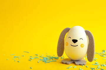 Easter eggs cute bunny on yellow background. Funny decoration. Happy Easter