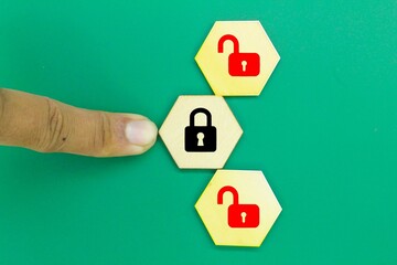 Obraz premium hexagon with with one lock icon locked and two more unlock locks. the concept of safety