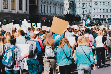 Young people marching on the street protest. Take a part in a march. Rally. Movement. Protest in...