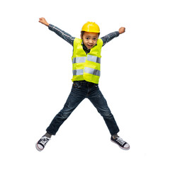 building, construction and profession concept - smiling little boy in yellow safety vest and helmet...
