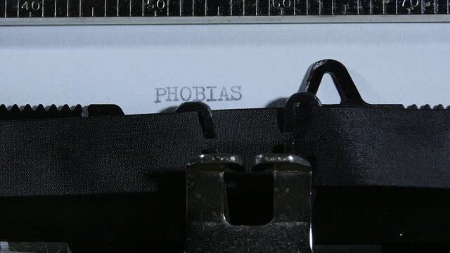 Typing PHOBIAS with an old manual typewriter