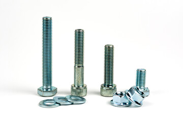 several bolts with nuts made of silver metal. Close-up isolated on a white background.