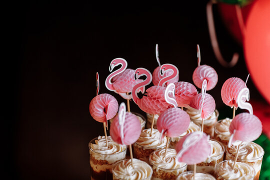 birthday exitic catering, table with modern desserts, cupcakes, sweets with fruits. delicious candy bar at expensive birthday party. space for text. baby shower. holiday celebration