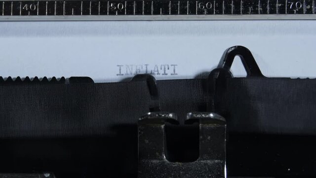 Typing INFLATION with an old manual typewriter