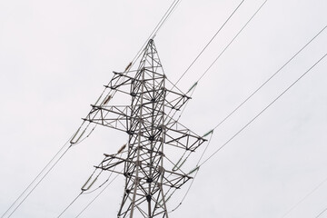 Power transmission lines and gray sky