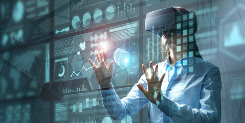 Businesswoman in vr glasses touching graphs on a virtual screen with HUD interface. Internet of...