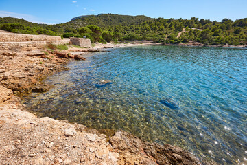 Turquoise waters in Cabrera island shoreline landscape. Balearic archipelago. Spain