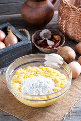 Grated potatoes in a bowl. Preparation fried potato pancakes. Step by step