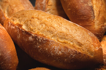 Lots of French bread rolls. Freshly baked French rolls are delicious. Close-up