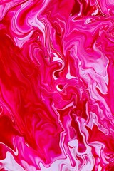 Photo of attractive abstract background: spilled red and caramel pink nail polish, marbled blend effect