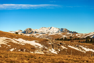 Winter landscape of the Lessinia plateau (Altopiano della Lessinia) and mountain range of the Monte Carega (small Dolomites), Velo Veronese municipality, Verona province, Veneto, Italy, Europe.