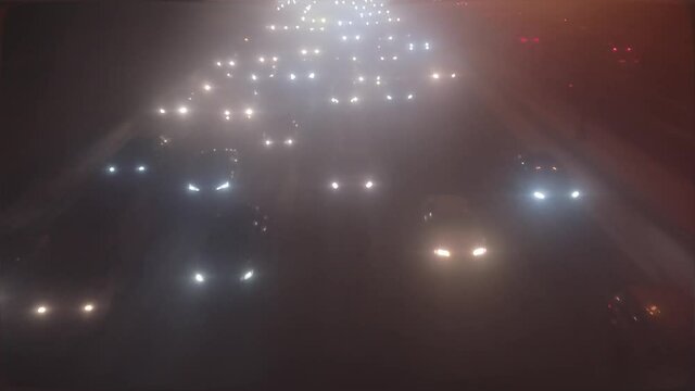 car headlights through cloudy glass