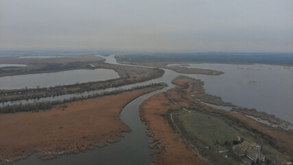 Aerial view of the many rivers and fields on a cloudy autumn day. Ukraine
