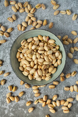 pistachio nuts on stone surface
