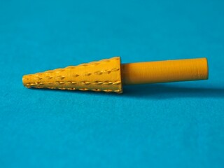 Rotating thorn head on a blue background. Tool for grinding, polishing, shaping, burnishing various surfaces