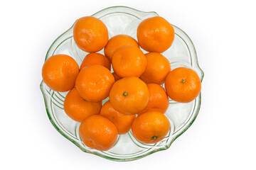Top view of the tangerines in vintage glass fruit vase