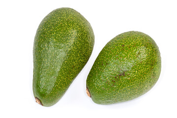 Two whole green avocado fruits on a white background