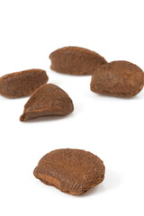 Fototapeta na wymiar brazilian nut with shelles isolated on white background