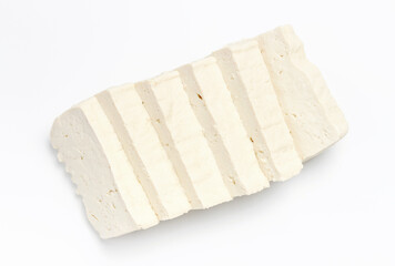 A sliced pieces of tofu on white background close-up.