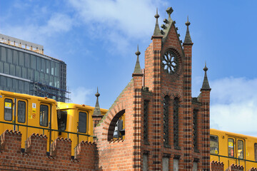 Yellow S-Bahn on Oberbaum bridge over the Spree river, Berlin, Germany