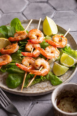 Freshly cooked grille shrimps with letucce on a plate