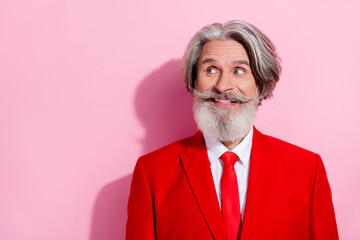 Portrait of positive groomed grandfather look interested empty space isolated on pink color background