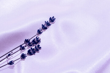 Silk fabric texture with lavender sprigs in color of the year 17-3938 Very Peri.