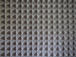 Grey acoustic foam rubber. Soundproof pyramids, full frame.