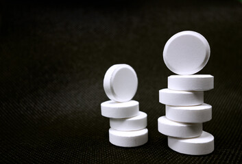 Composition with pills on the table on a dark background.