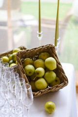 glass of wine and apples on table