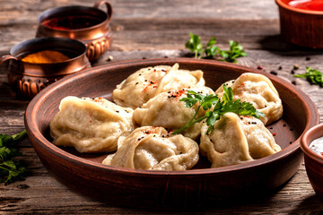 Traditional manti food on plate, top view. The concept of oriental cuisine. Uzbek food manty dumplings. Uzbek food. banner, catering menu recipe place for text