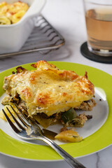 Potato and leek gratin, topped with cheese. Close-up.
