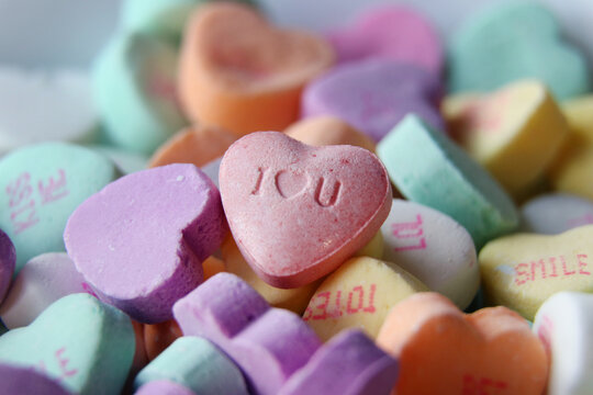 Colorful candy hearts with loving messages are a traditional treat on Valentine`s Day.