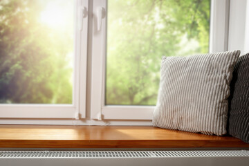 Spring, a window with a sill and an empty space on a beautiful sunny day 