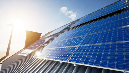 solar panels and wind power turbines in a sunset, solar panels on the roof © ahmet