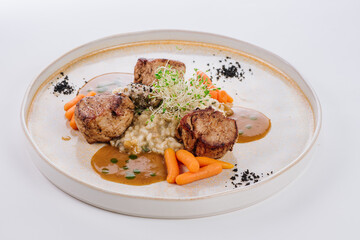 Pork tenderloin steak with olive-mustard tapenade and mushroom risotto
