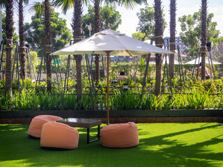 colorful bean bag seats to relax on grass outdoors. A convenient place to relax, a company or for one.