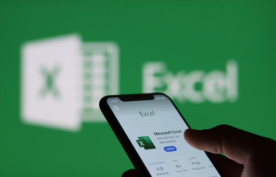 Microsoft Excel On Smartphone Screen And Microsoft Excel Logo  Background : Chiang Mai, Thailand, January 9, 2022