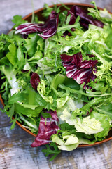 Fresh mix of salads in a bowl. Macro.