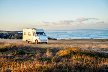 A small motor home parked by the beach on Vicentina Coast, Portugal
